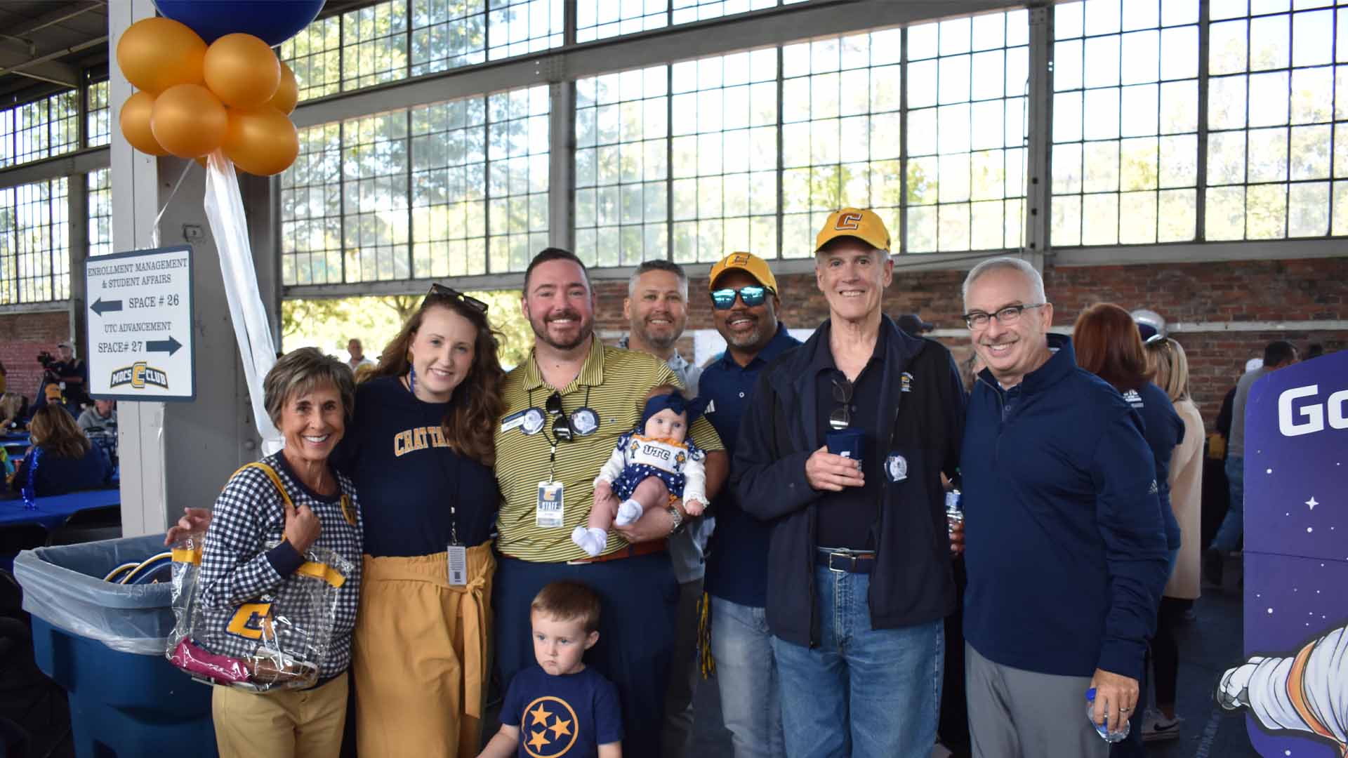 Group photo of alumni at a tailgate