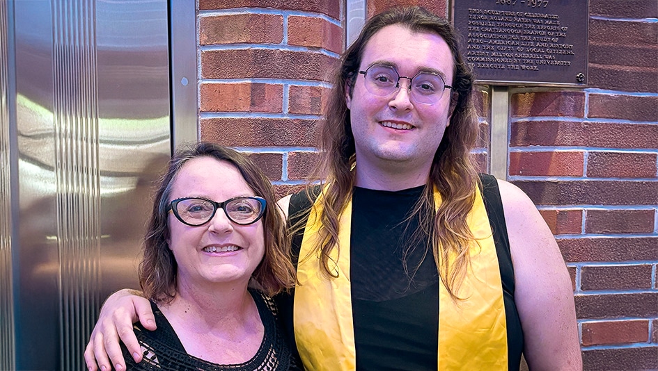 Two people smiling at camera