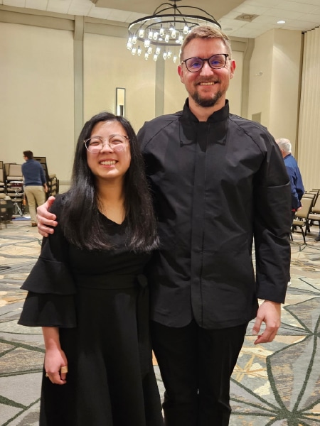 Anna Grace smiles with a fellow band member.