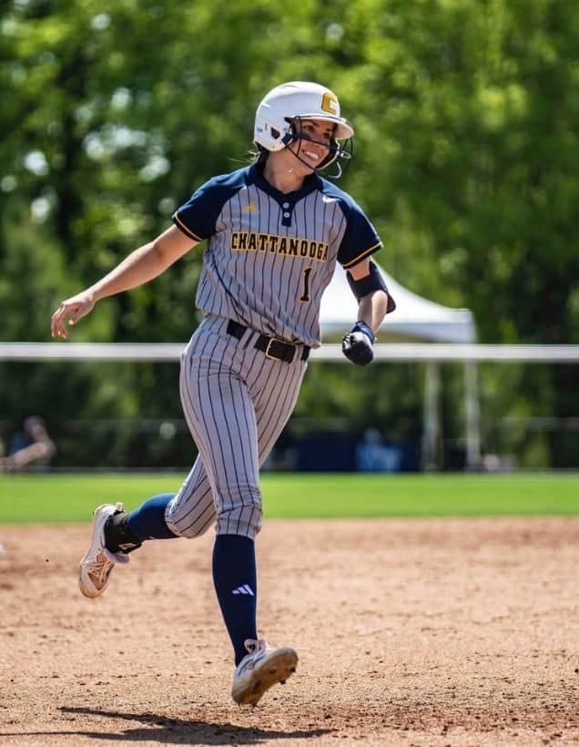 Acelynn Sellers running on a softball field.