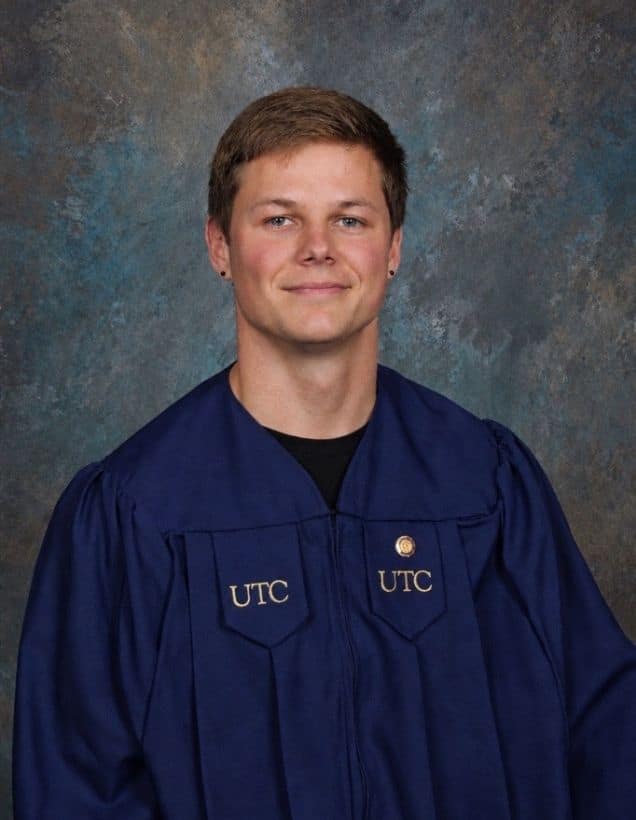 Aniken Johnson in UTC graduation gown.