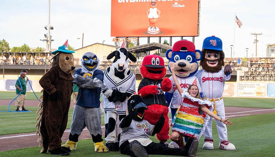 Annaka Hall on the Lookouts' field with local mascots, including Scrappy.