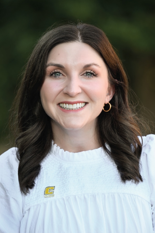 Headshot of Jessica Pilcher wearing a white shirt with a power c pin.